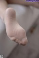 A close up of a person's foot with a pair of socks.