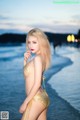 Atittaya Chaiyasing beauty poses hot on the beach with a yellow bikini (41 photos)